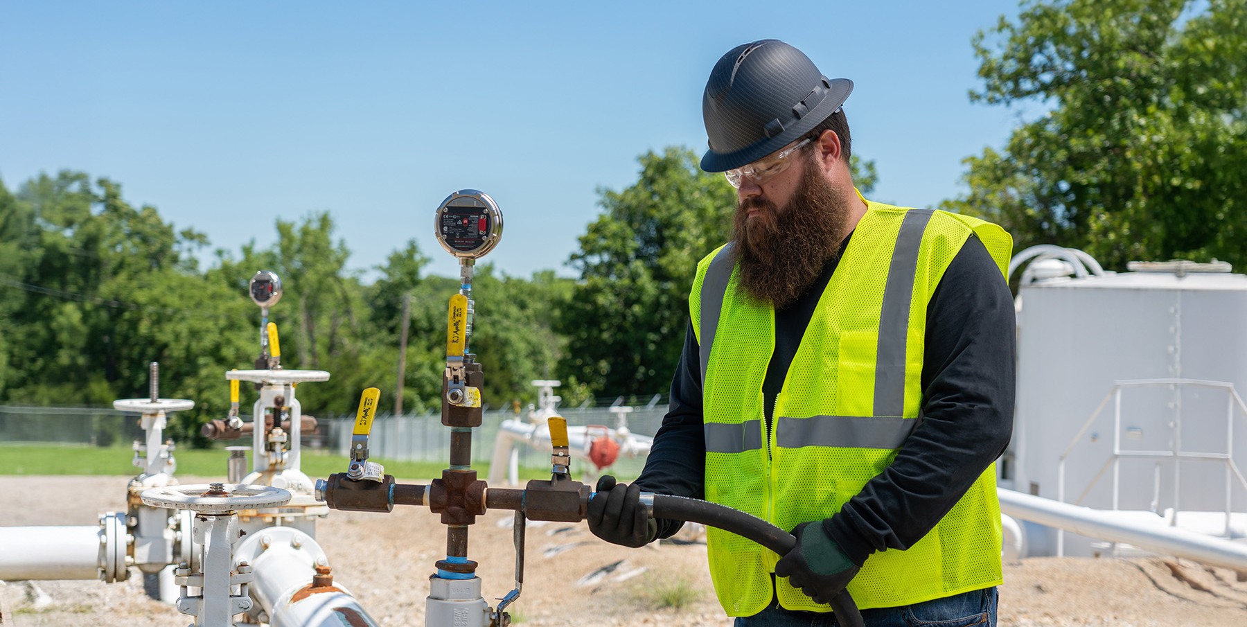 Field technician servicing pipeline